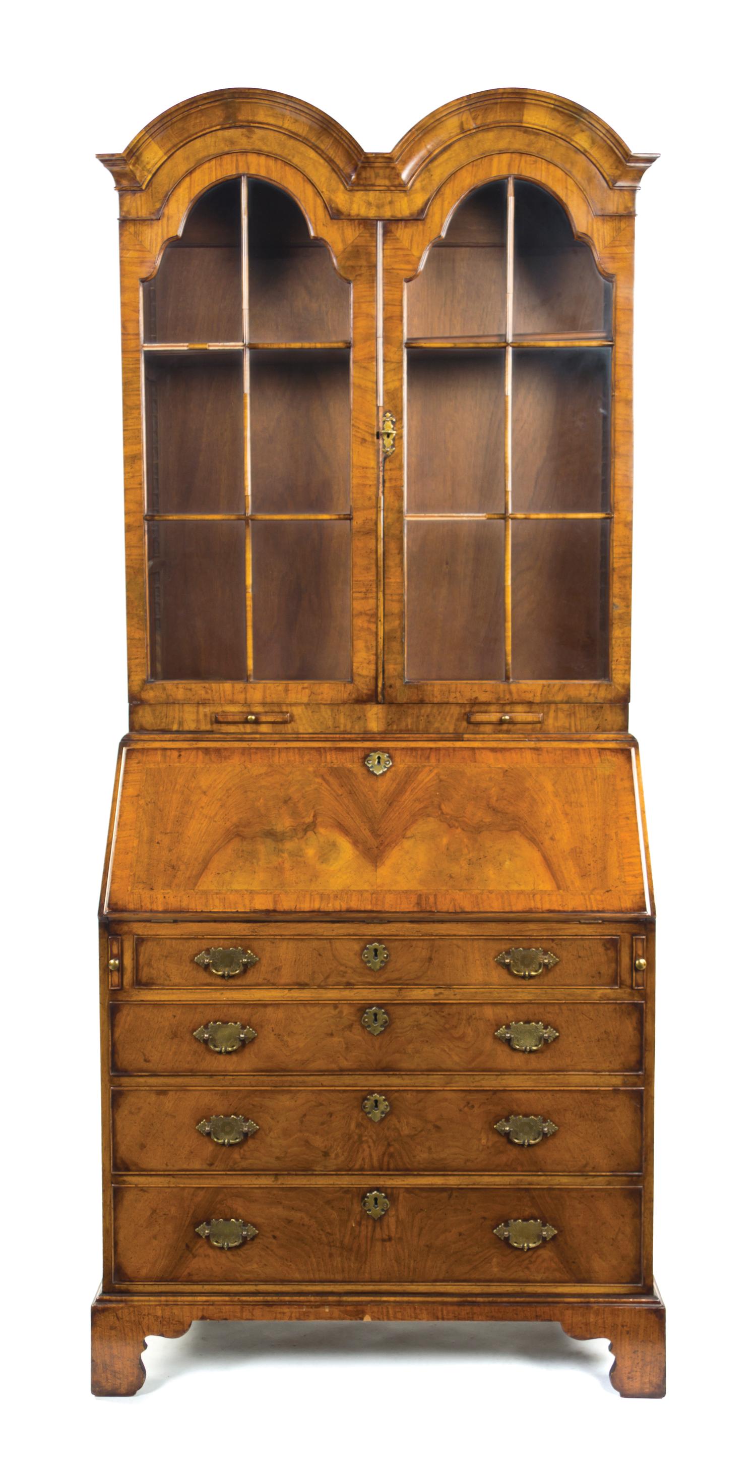 A Queen Anne Style Walnut Double Domed Secretary Bookcase, Height 80 x width 34 1/2 x depth 19 3/4 inches.