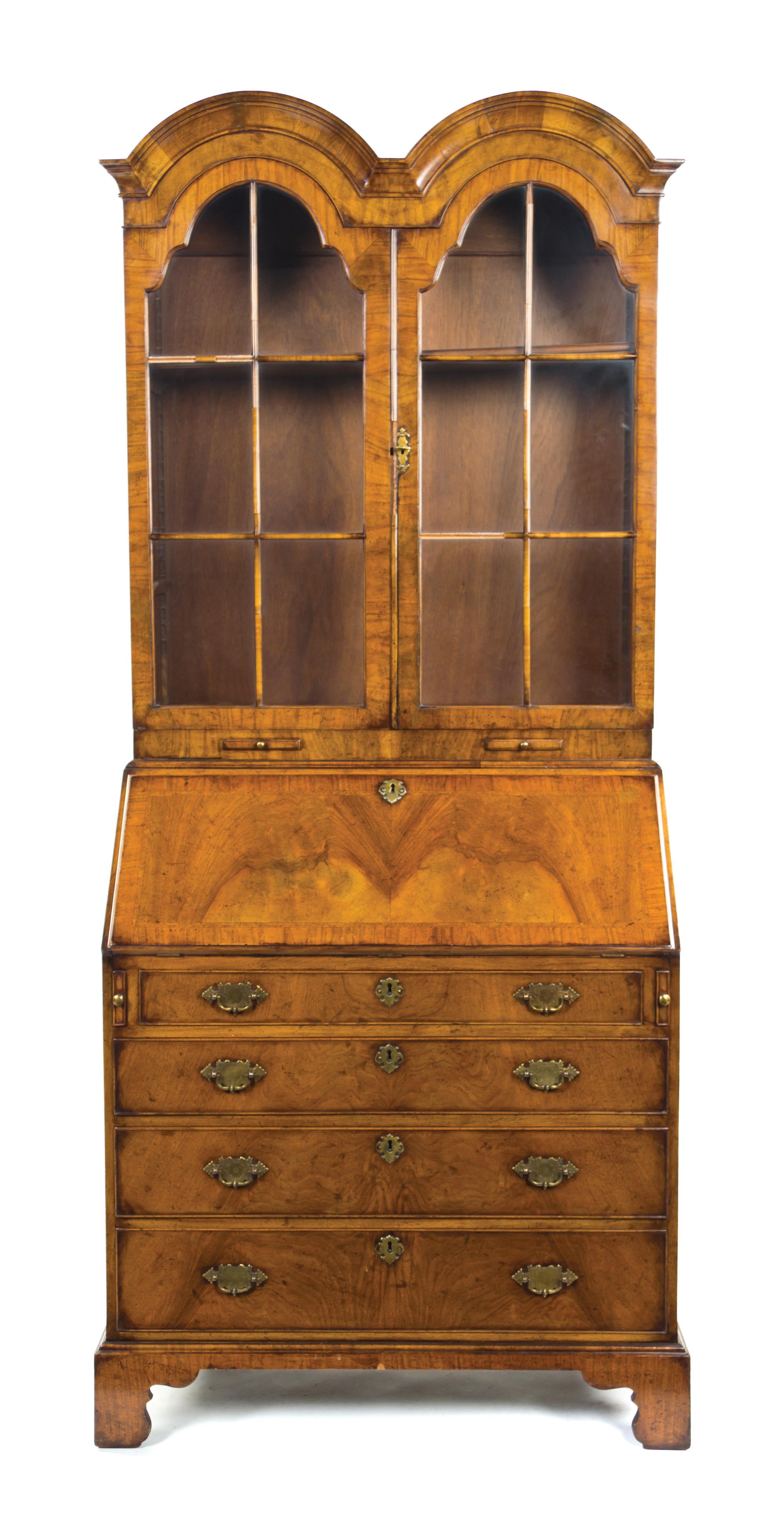 A Queen Anne Style Walnut Double Domed Secretary Bookcase, Height 80 x width 34 1/2 x depth 19 3/4 inches.