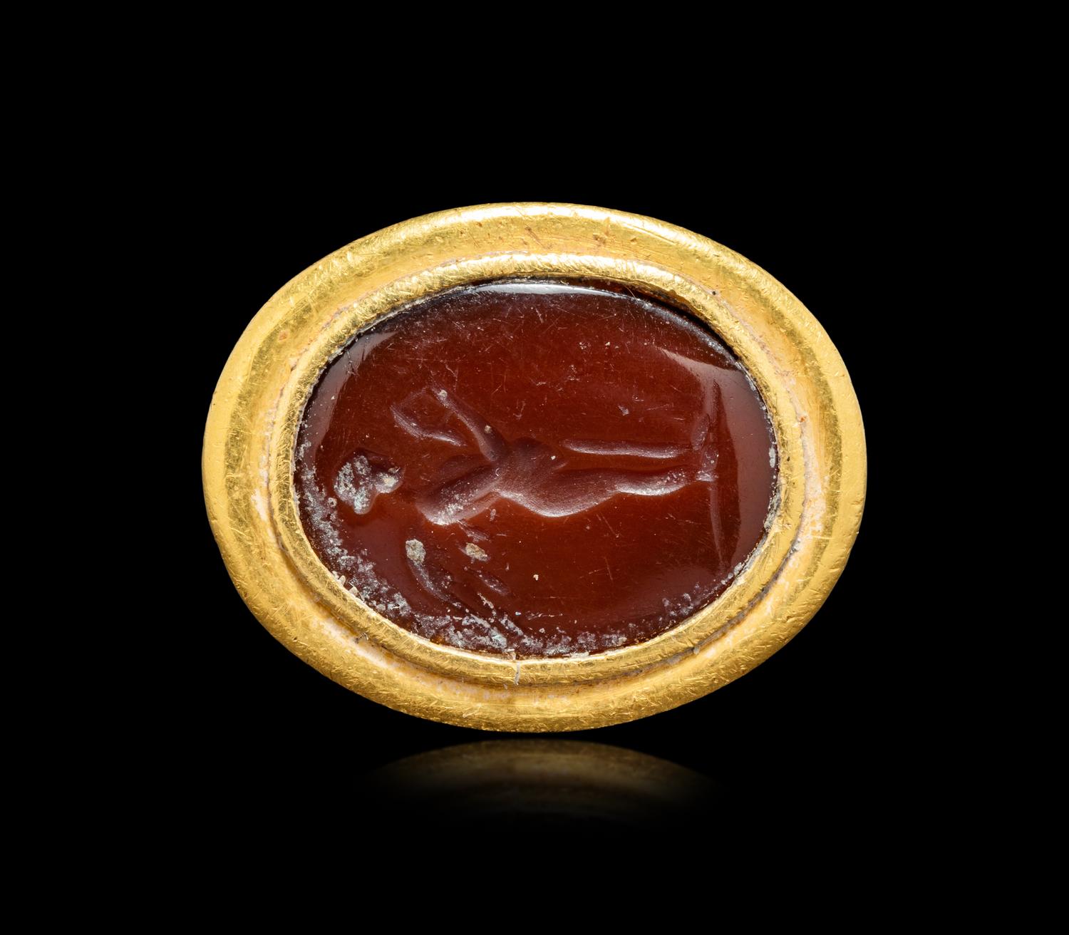 A Hellenistic Gold and Sard Finger Ring with the God Eros
