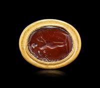 A Hellenistic Gold and Sard Finger Ring with the God Eros