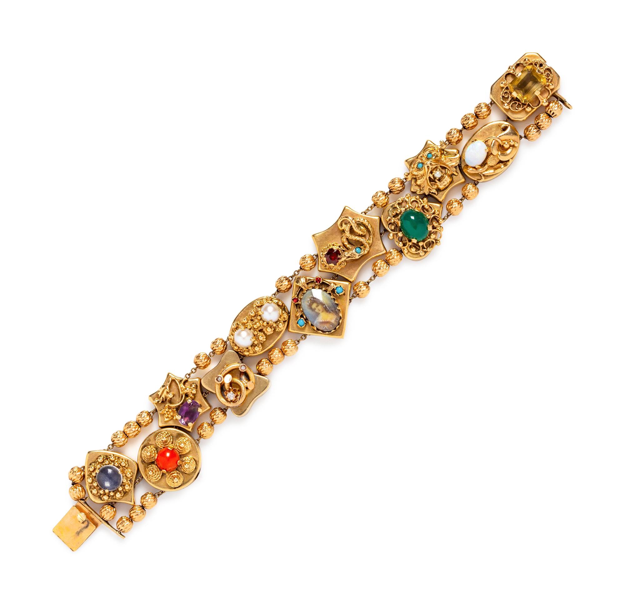 A 14 Karat Yellow Gold Charm Slide Bracelet with Multigems,