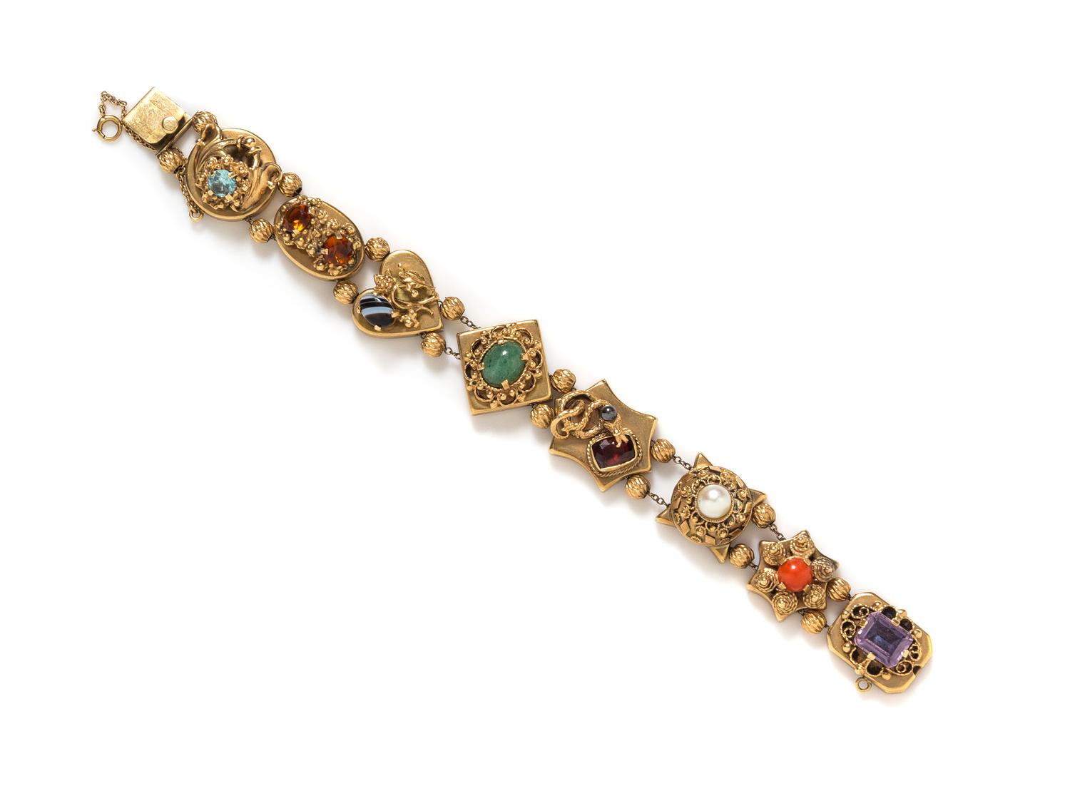A Vintage 14 Karat Yellow Gold and Multi Gem Slide Charm Bracelet, 31.50 dwts.