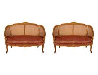 A Pair of Louis XV Style Stained and Giltwood Settees