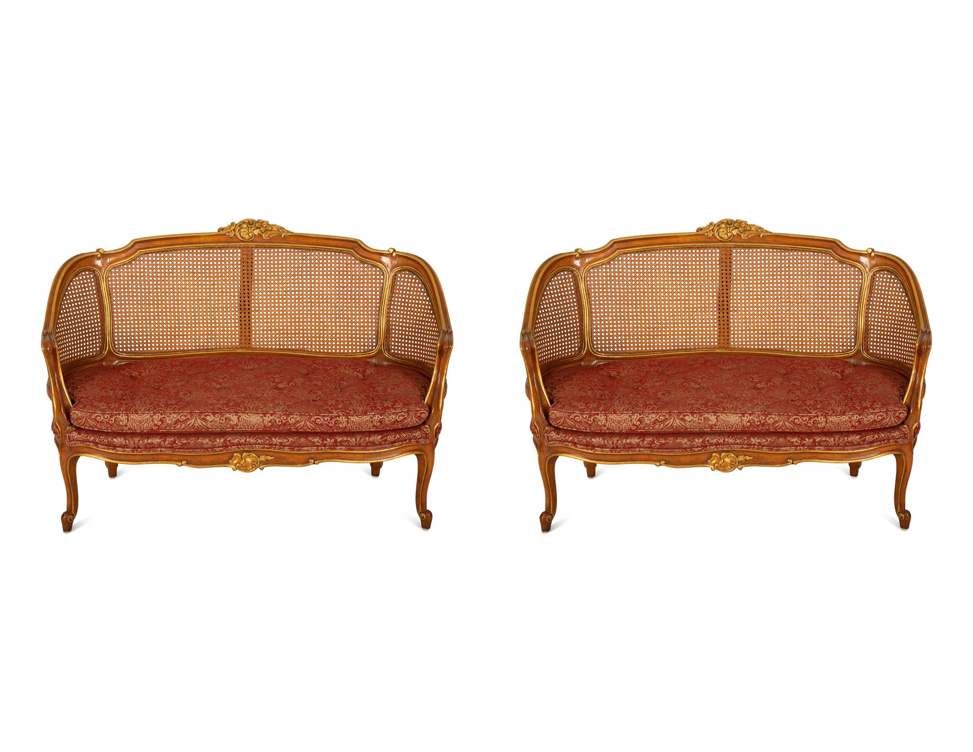 A Pair of Louis XV Style Stained and Giltwood Settees