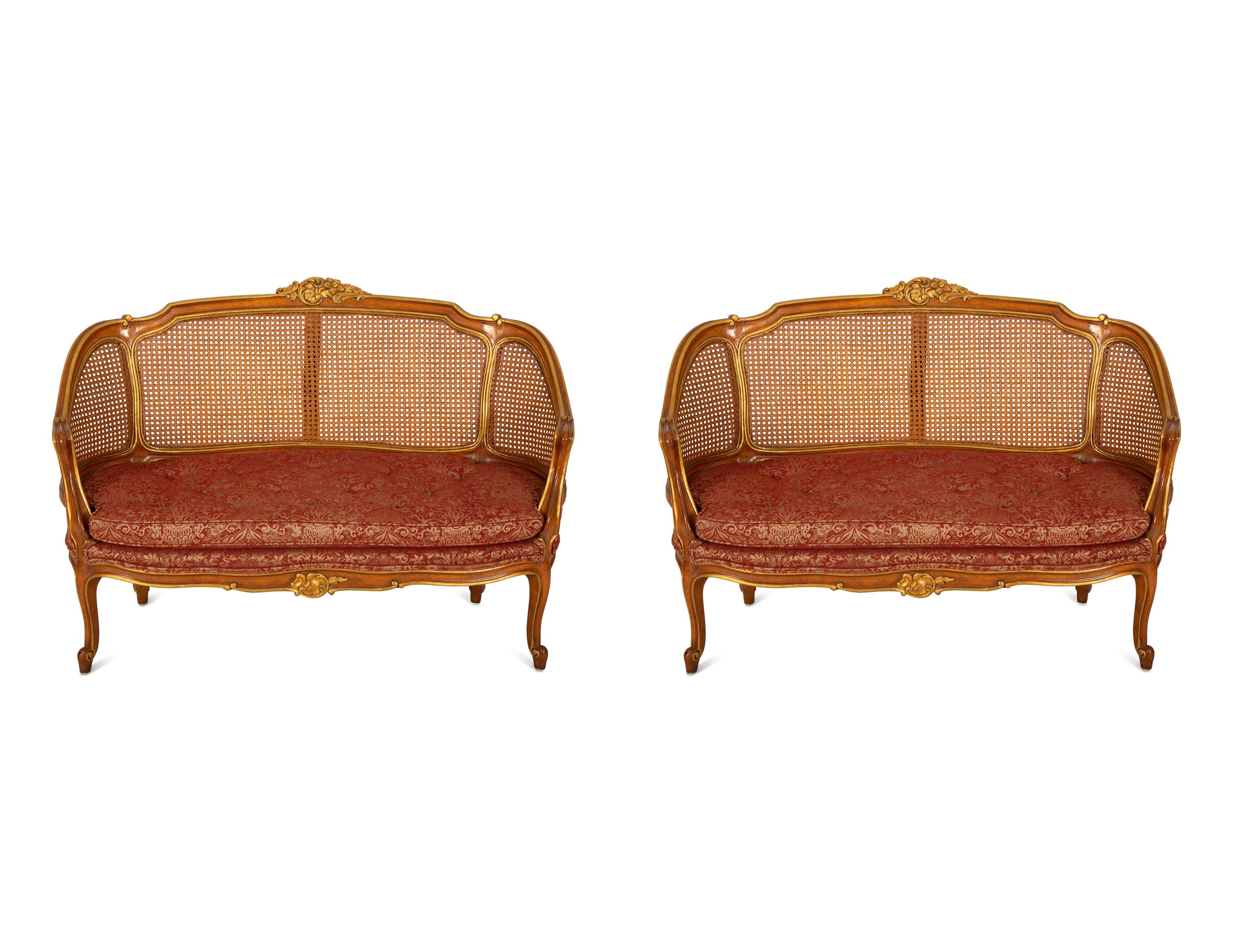 A Pair of Louis XV Style Stained and Giltwood Settees