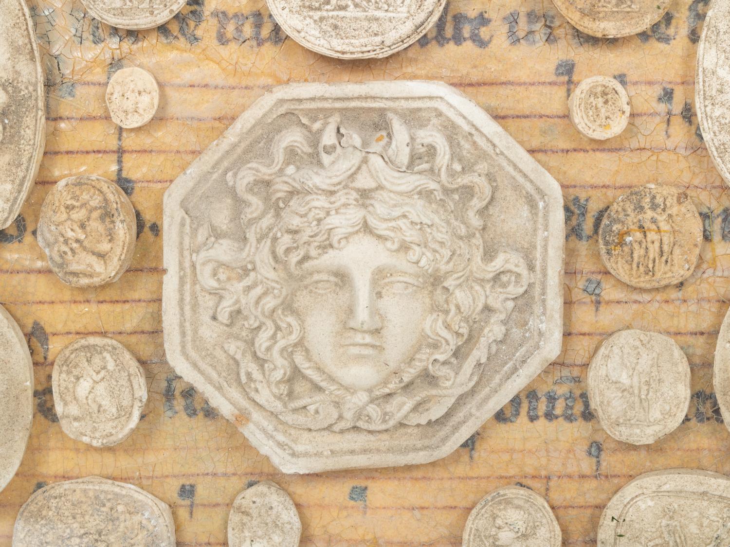 A Framed Collection of Grand Tour Style Plaster Intaglios