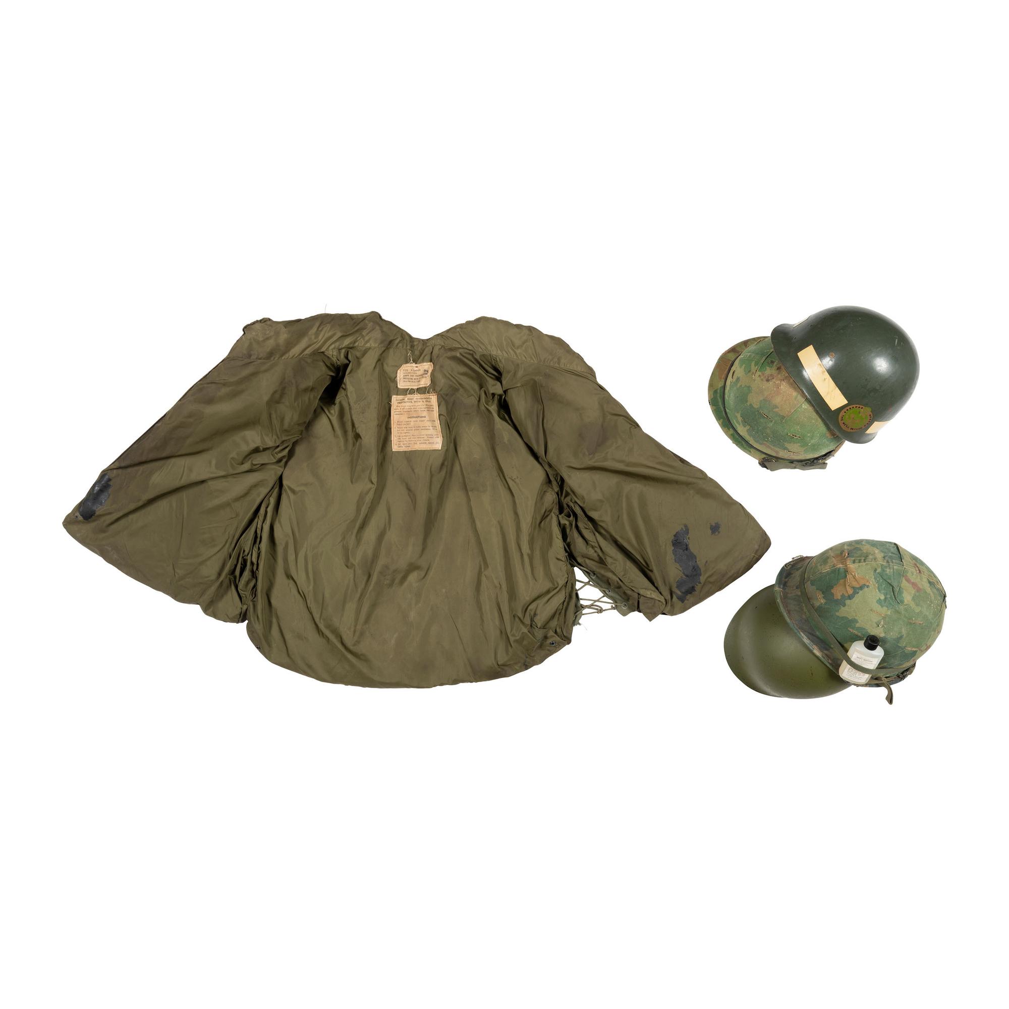 Group of Two Vietnam Era M1 Helmets and Flak Jacket