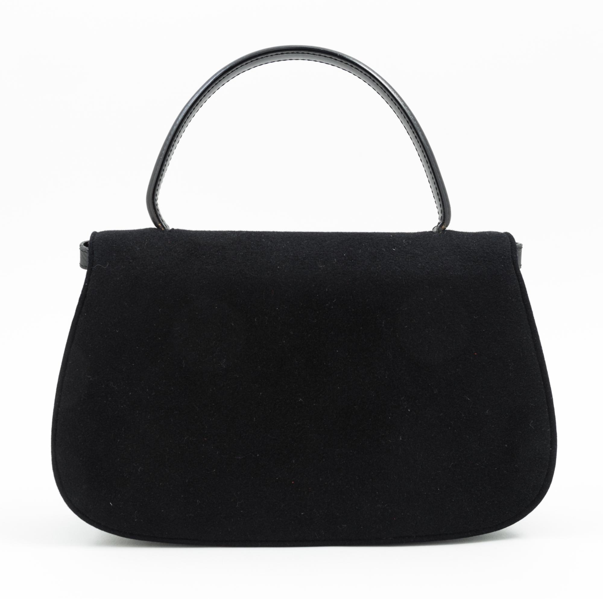 A Gucci Black Suede Flap Handbag, 11" x 7" x 2.5"; Handle drop: 4.5".