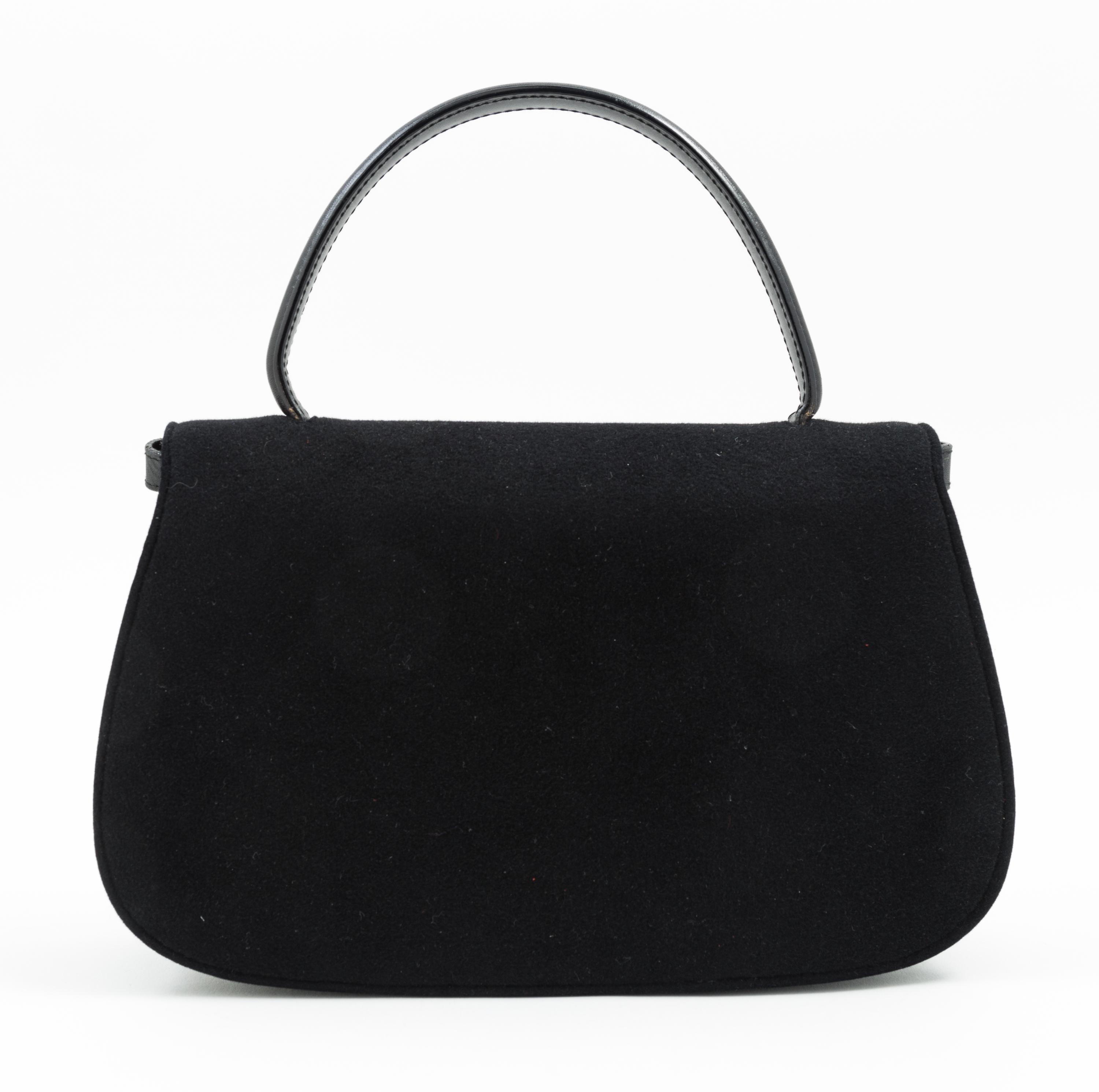 A Gucci Black Suede Flap Handbag, 11" x 7" x 2.5"; Handle drop: 4.5".