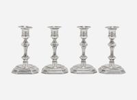 A set of four Elizabeth II weighted sterling silver candlesticks, Atkin Brothers, Sheffield, 1955
