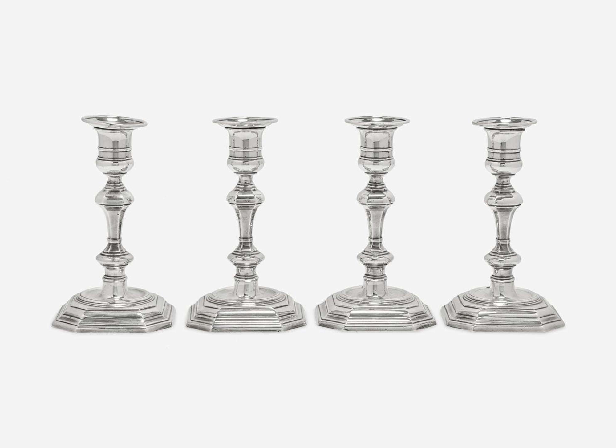 A set of four Elizabeth II weighted sterling silver candlesticks, Atkin Brothers, Sheffield, 1955