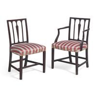 A Set of Eight George III Carved Mahogany Dining Chairs