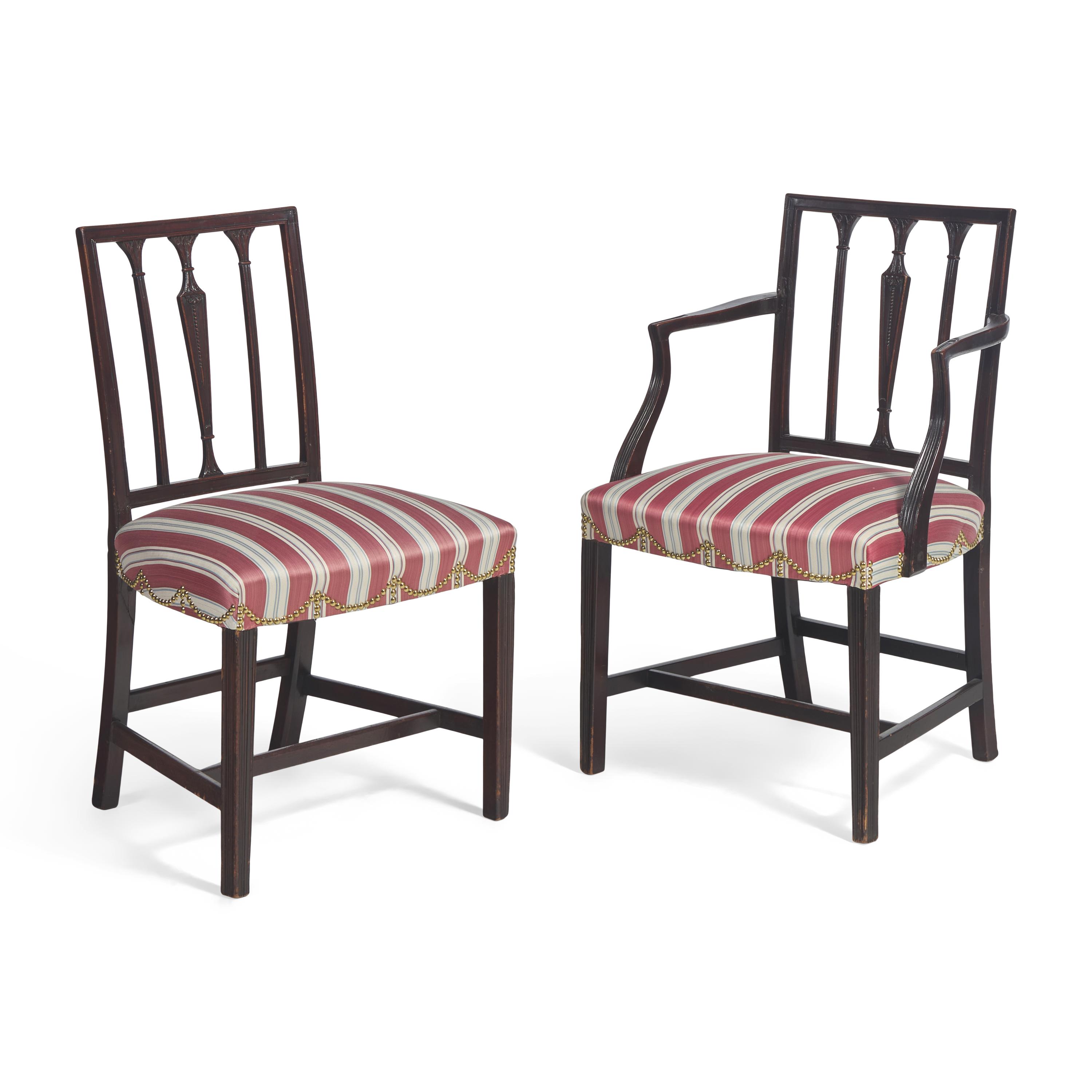 A Set of Eight George III Carved Mahogany Dining Chairs