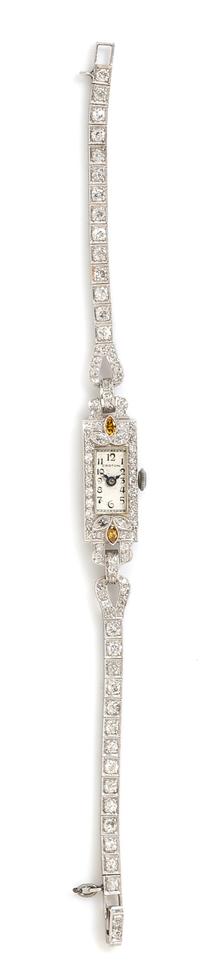 An Art Deco Platinum, Diamond and Colored Diamond Wristwatch, Croton, 13.10 dwts.