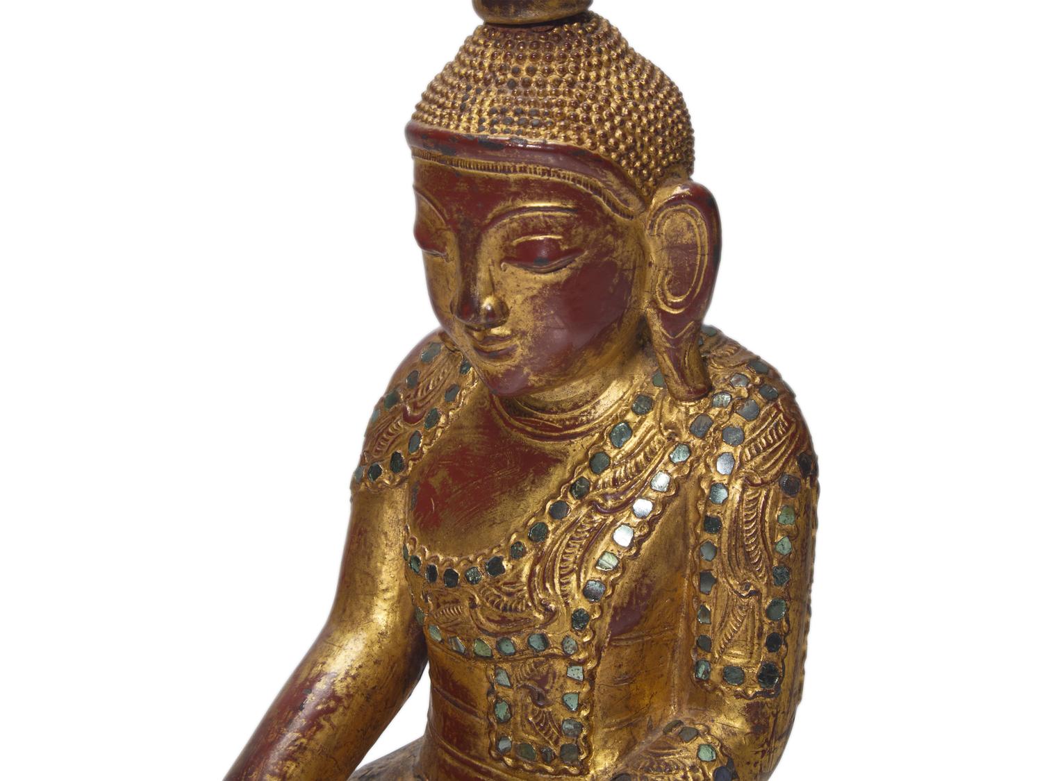A Burmese or Northern Thai Gilt-Lacquered Wood Figure of Buddha