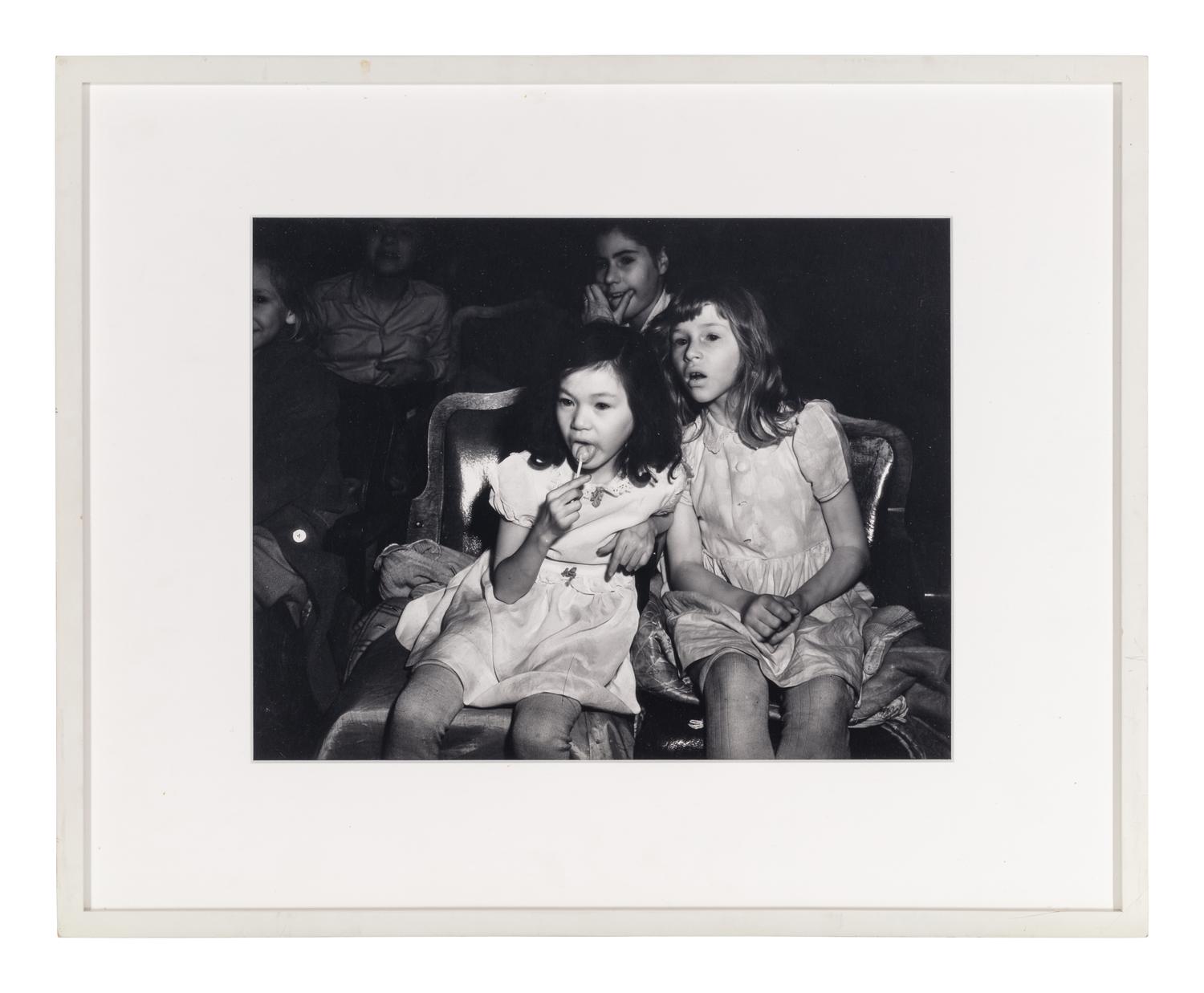 Weegee (1899-1968) Palace Theatre, New York City (Two girls with lollipops), 1950s