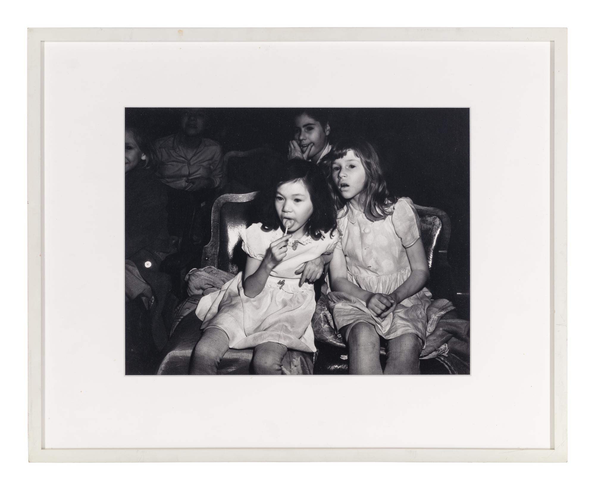 Weegee (1899-1968) Palace Theatre, New York City (Two girls with lollipops), 1950s