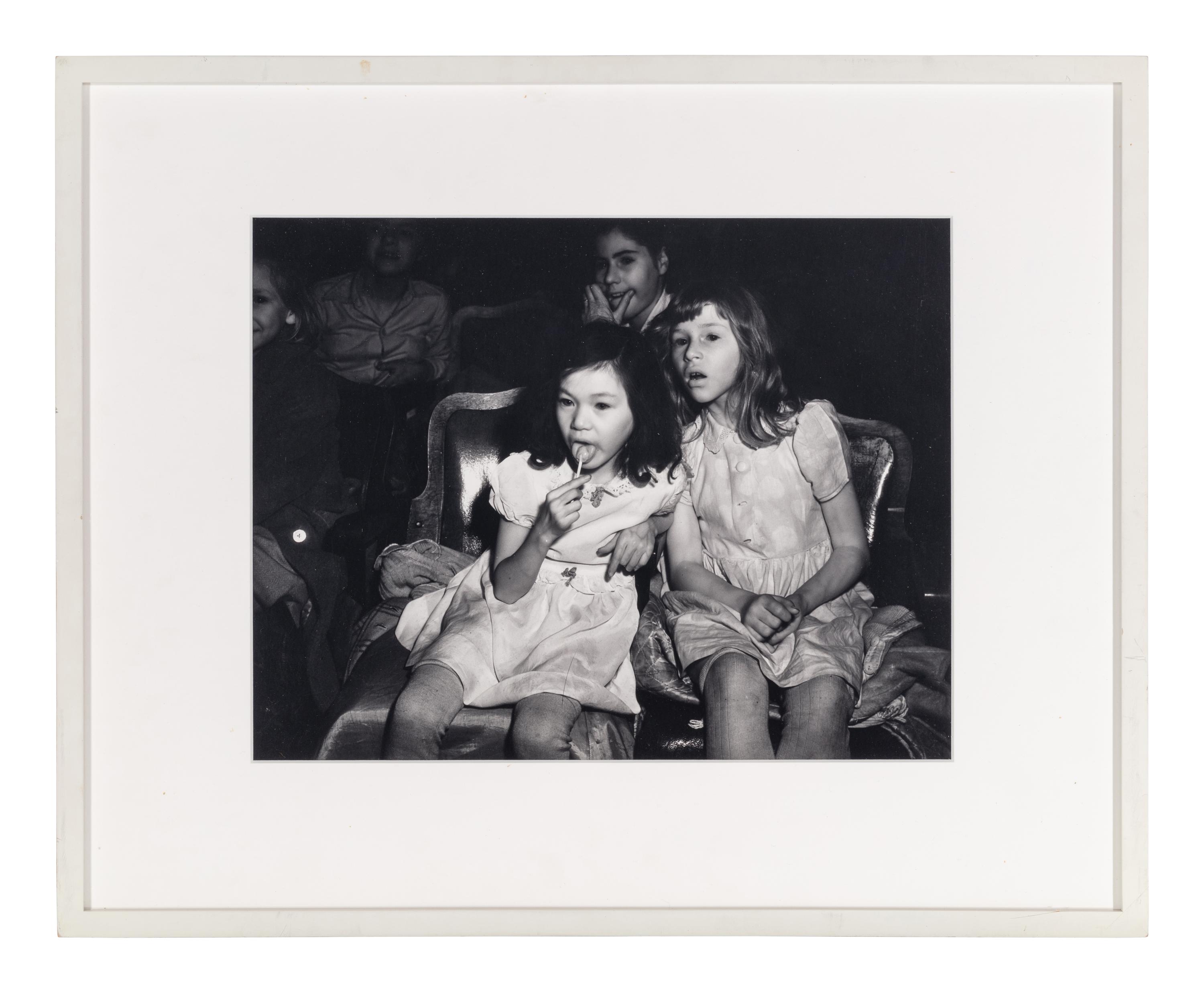 Weegee (1899-1968) Palace Theatre, New York City (Two girls with lollipops), 1950s