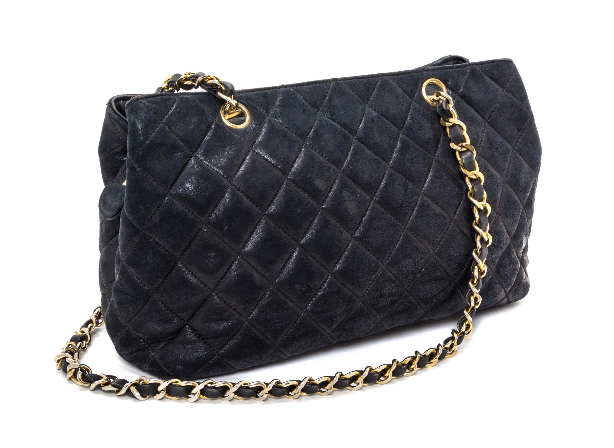 A Chanel Black Distressed Leather Quilted Handbag, 12" x 8" x 4".
