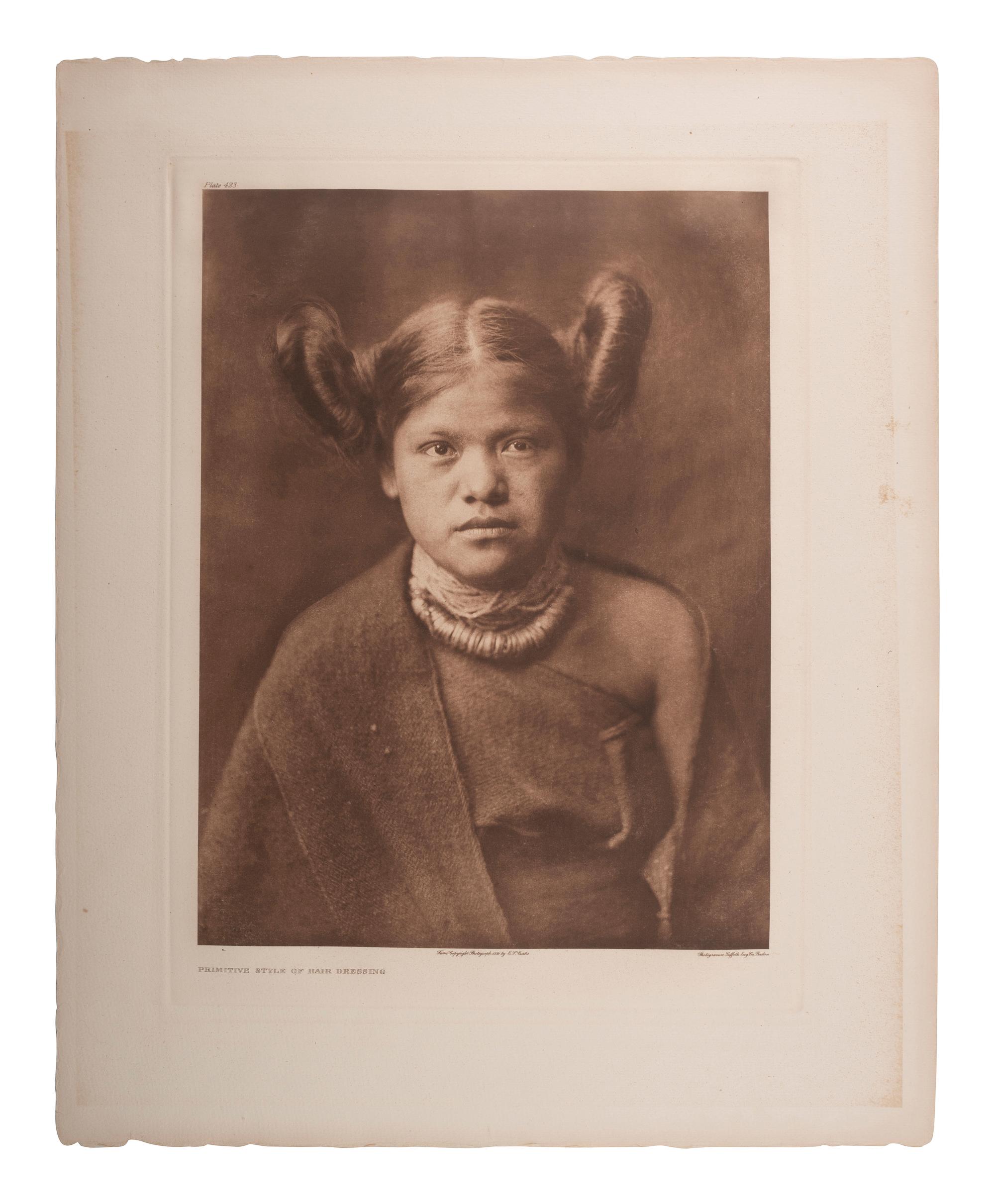 CURTIS, Edward (1868-1952). A group of 2 portfolio photogravures featuring female Hopi subjects modeling traditional and modified hair styles.
