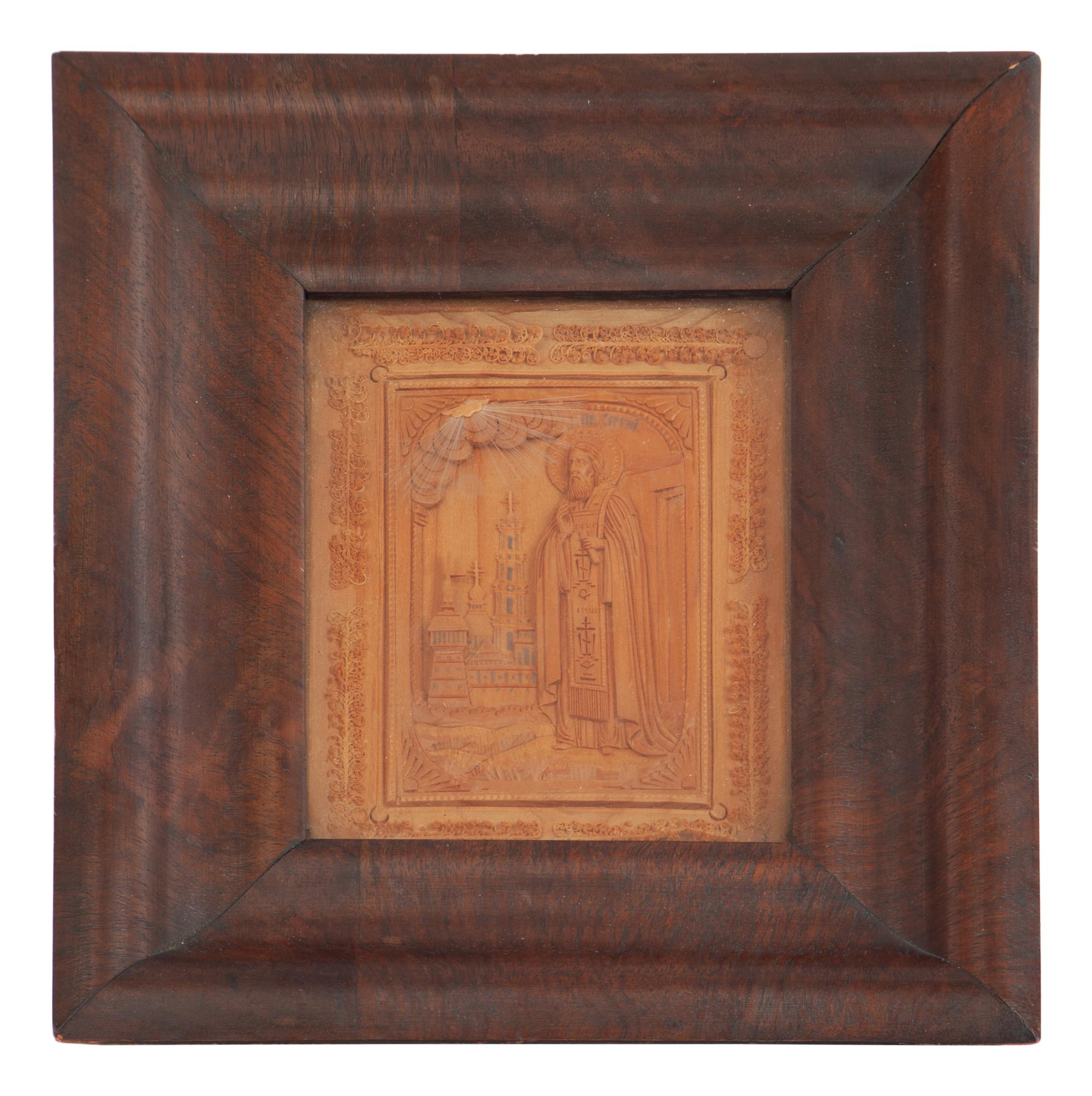 A Carved Wooden Panel depicting a Russian Orthodox Saint