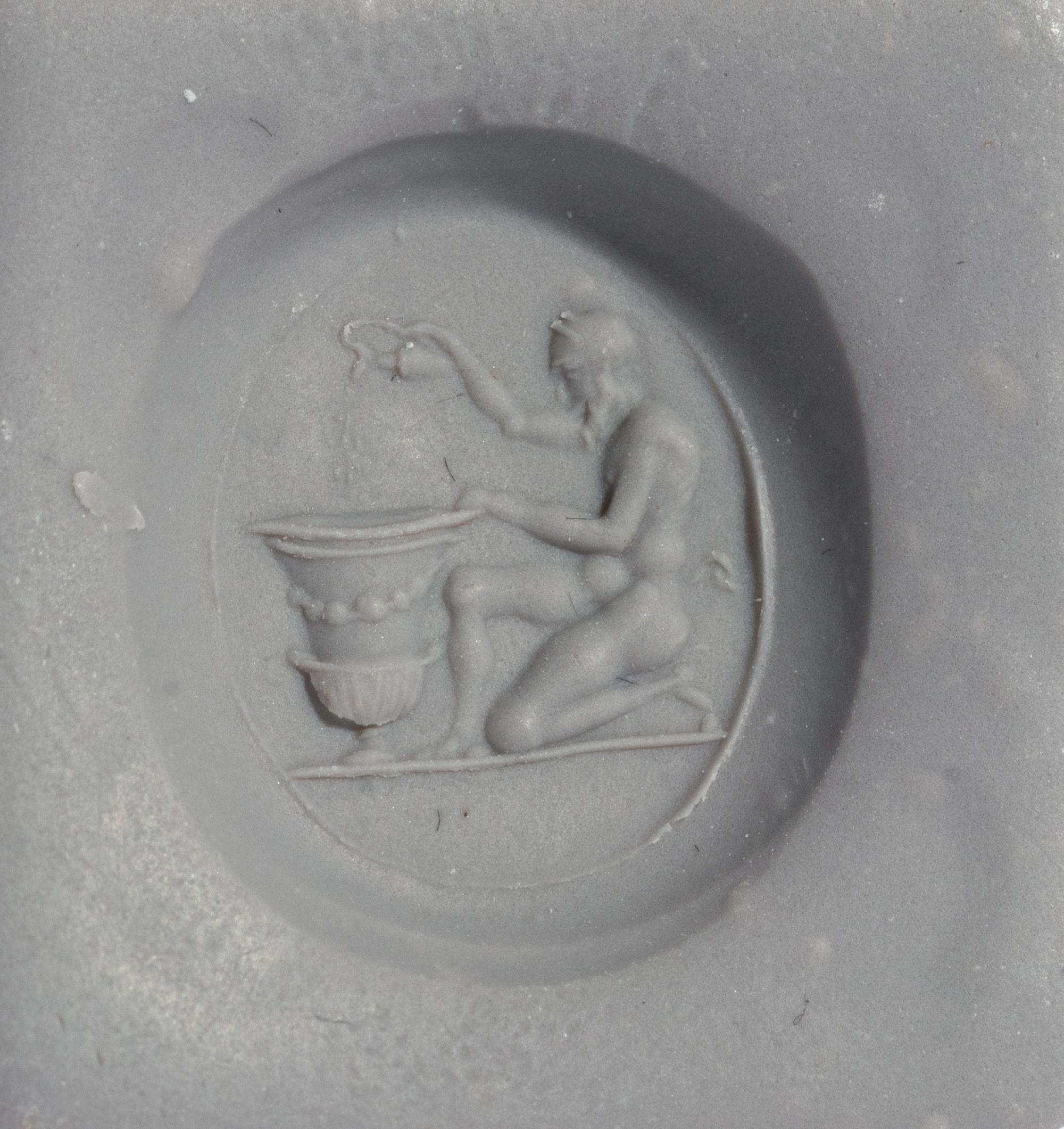 A Roman Carnelian Ring Stone with a Satyr Mixing Wine — Set in a gold ring