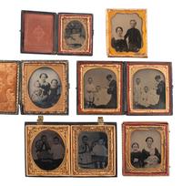 [EARLY PHOTOGRAPHY]. A group of 19 ambrotypes and tintypes of children of varying ages, some posed with their parents, incl. African American infant and pairs of images taken during the same sitting.
