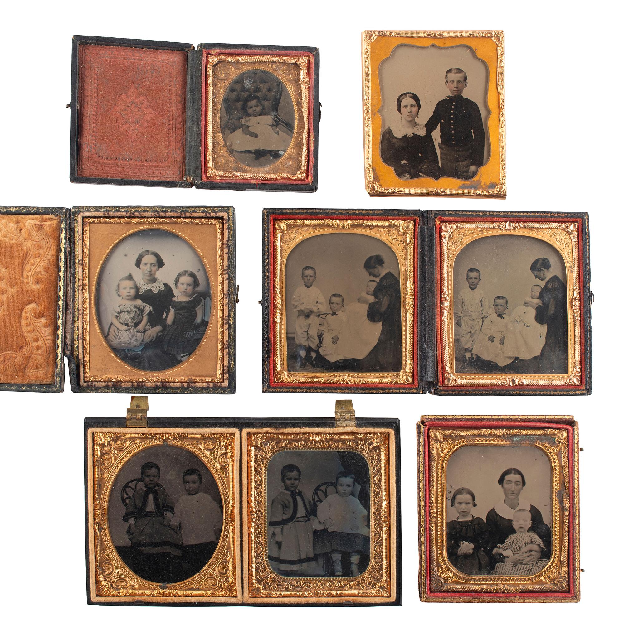 [EARLY PHOTOGRAPHY]. A group of 19 ambrotypes and tintypes of children of varying ages, some posed with their parents, incl. African American infant and pairs of images taken during the same sitting.