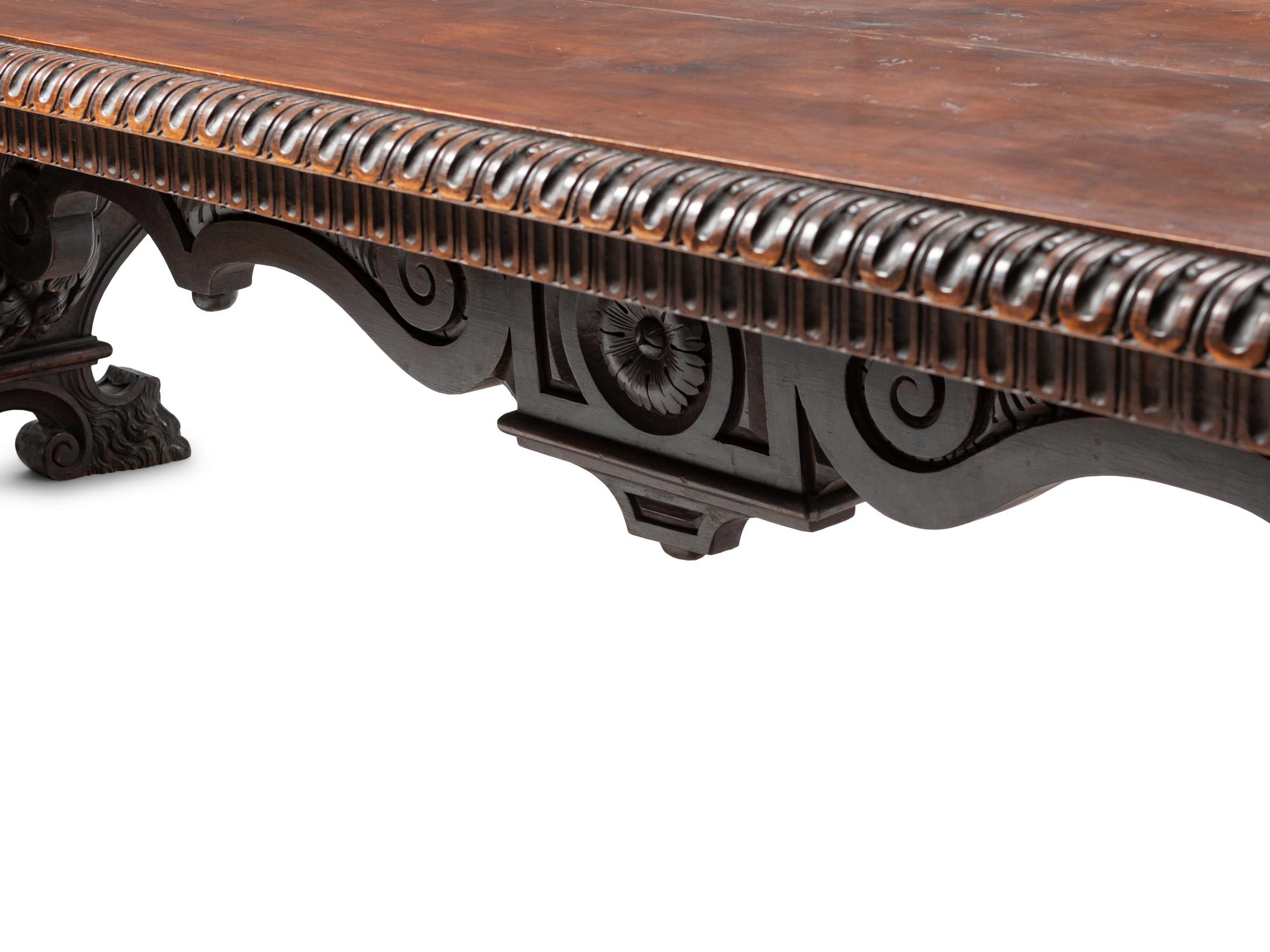An Italian Renaissance Revival Carved Walnut Refectory Table