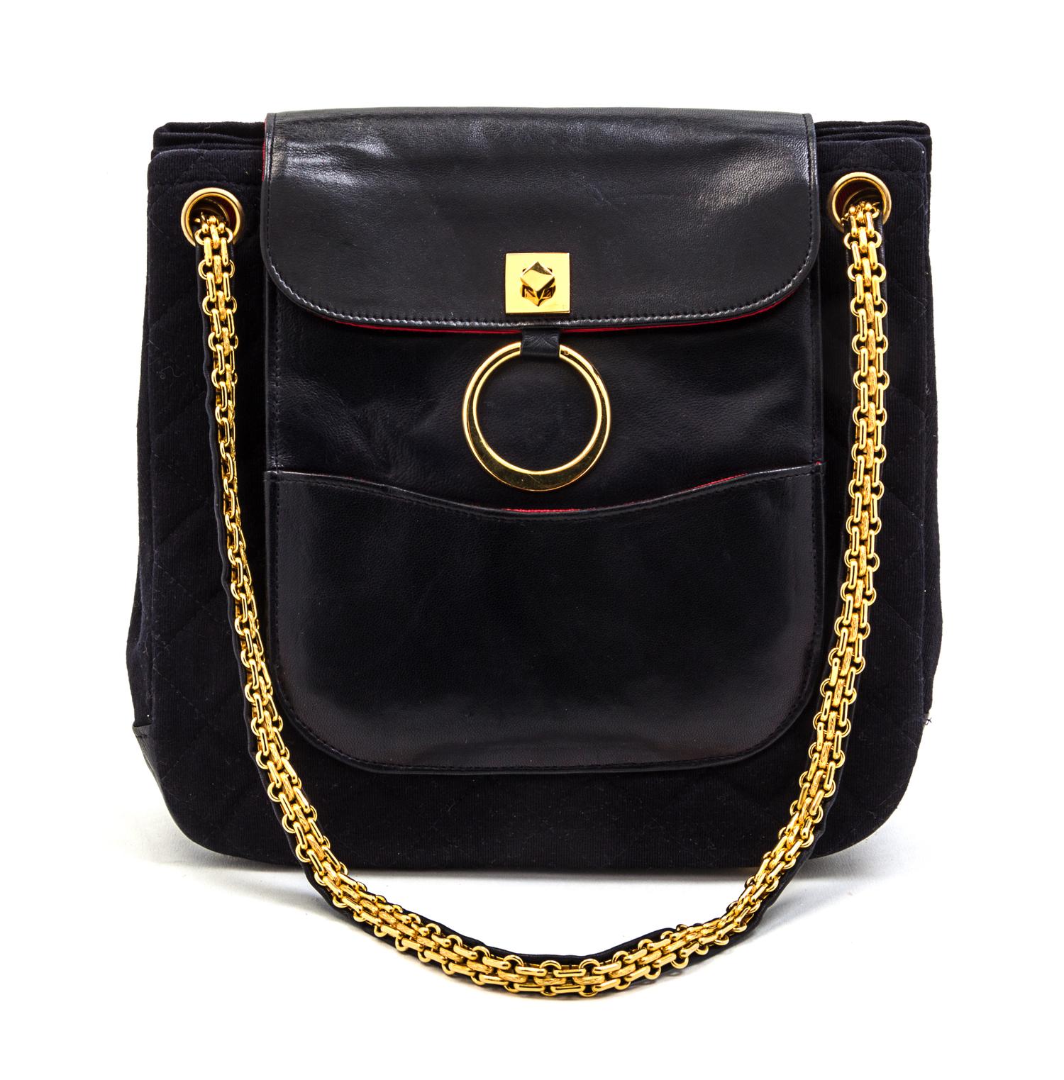 A Chanel Navy Quilted Jersey and Leather Bag, 9 x 8 1/2 x 3 inches.