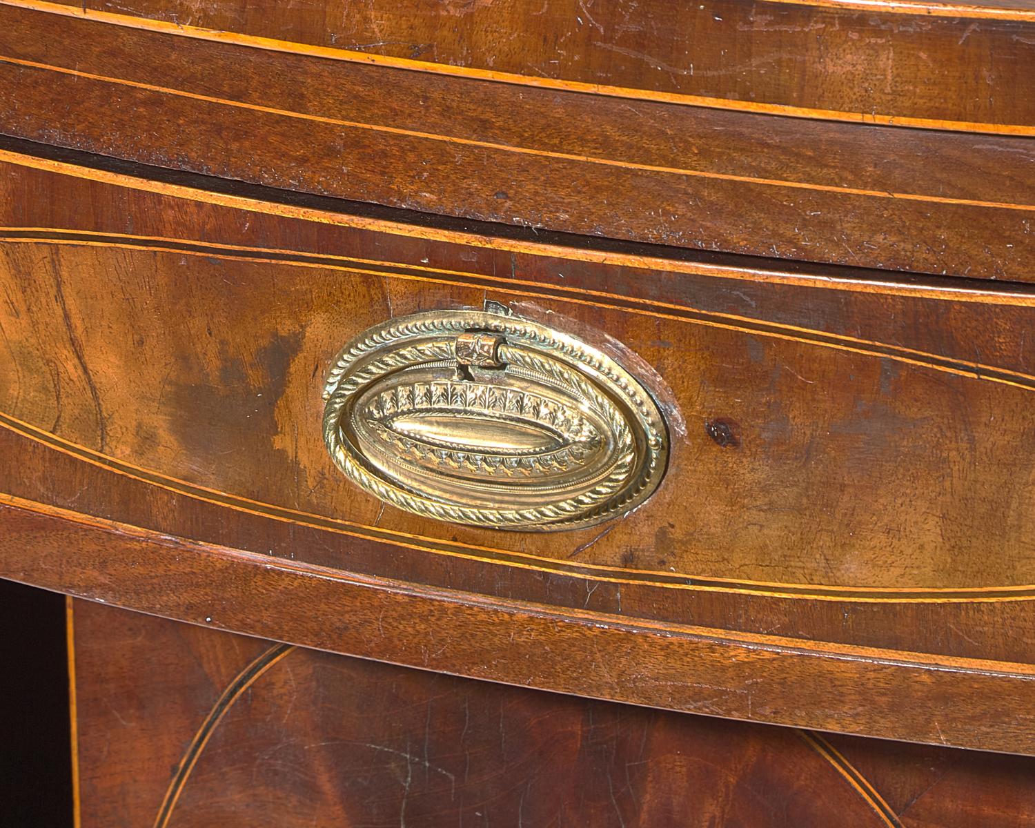 A Federal Inlaid and Figured Mahogany Serpentine Front Sideboard, New York, NY, Circa 1800
