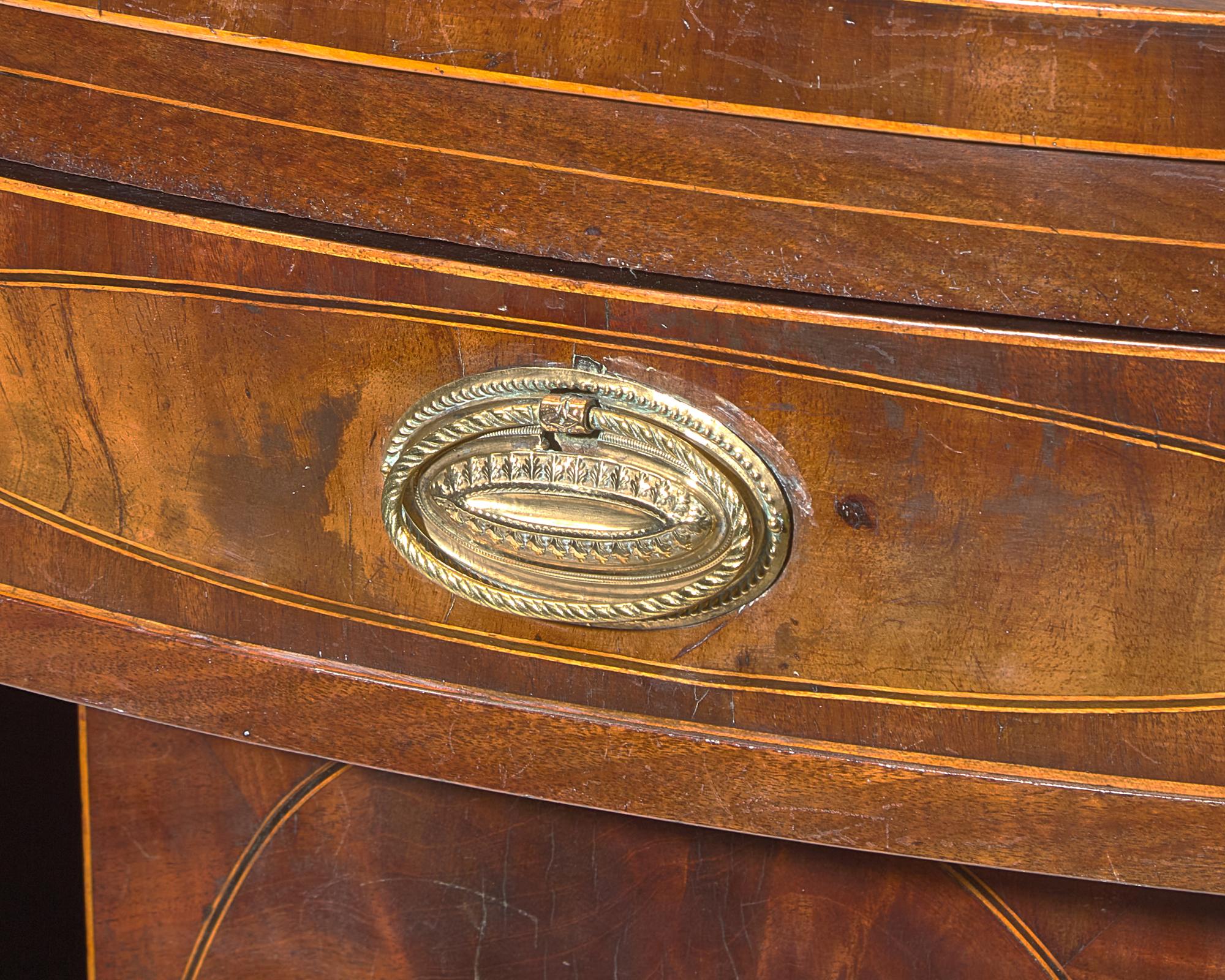 A Federal Inlaid and Figured Mahogany Serpentine Front Sideboard, New York, NY, Circa 1800