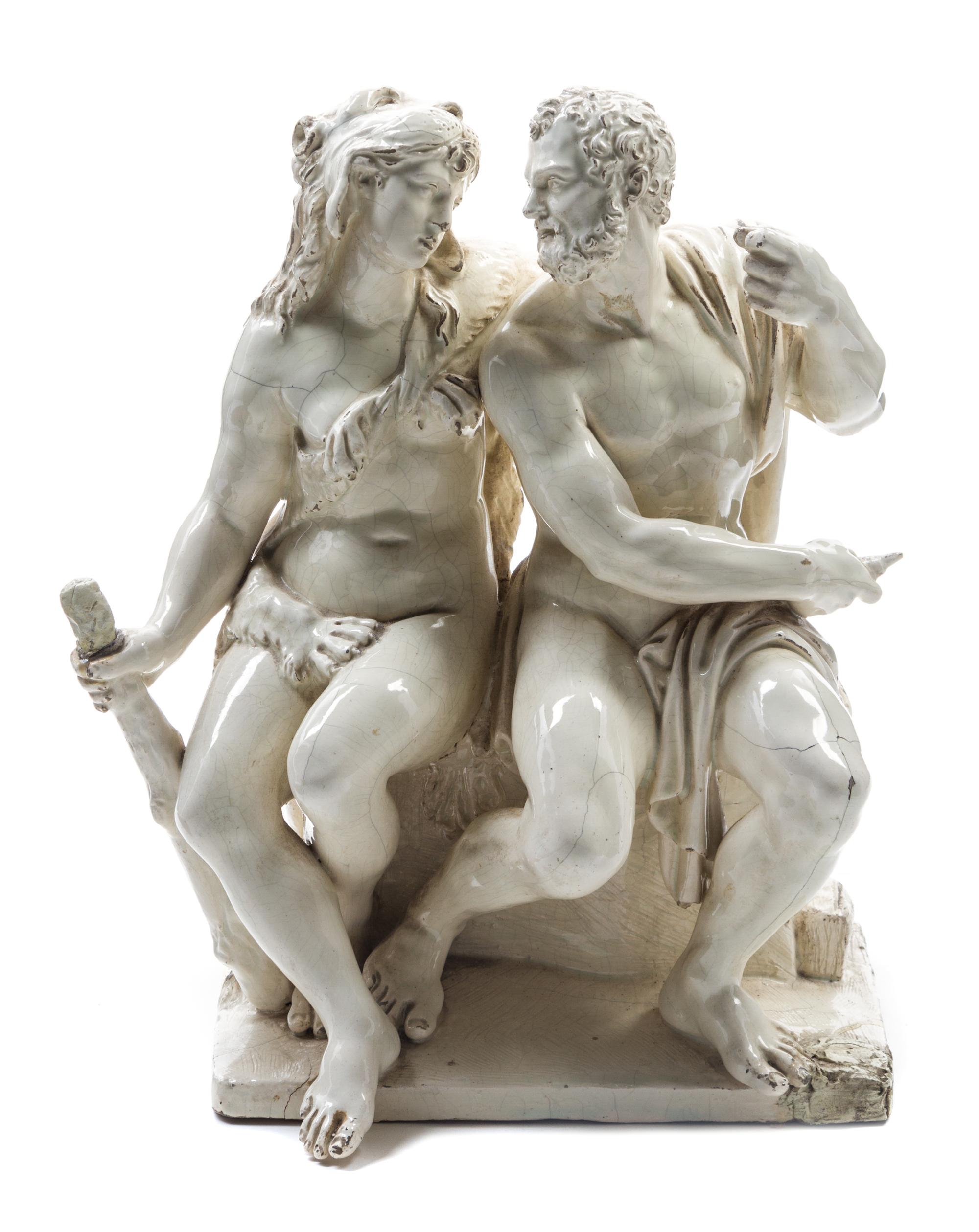 A Continental Glazed Stoneware Figural Group Height 12 1/4 inches.