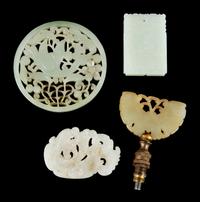 Four Jade Plaques Diameter of larget 3 1/4 inches.