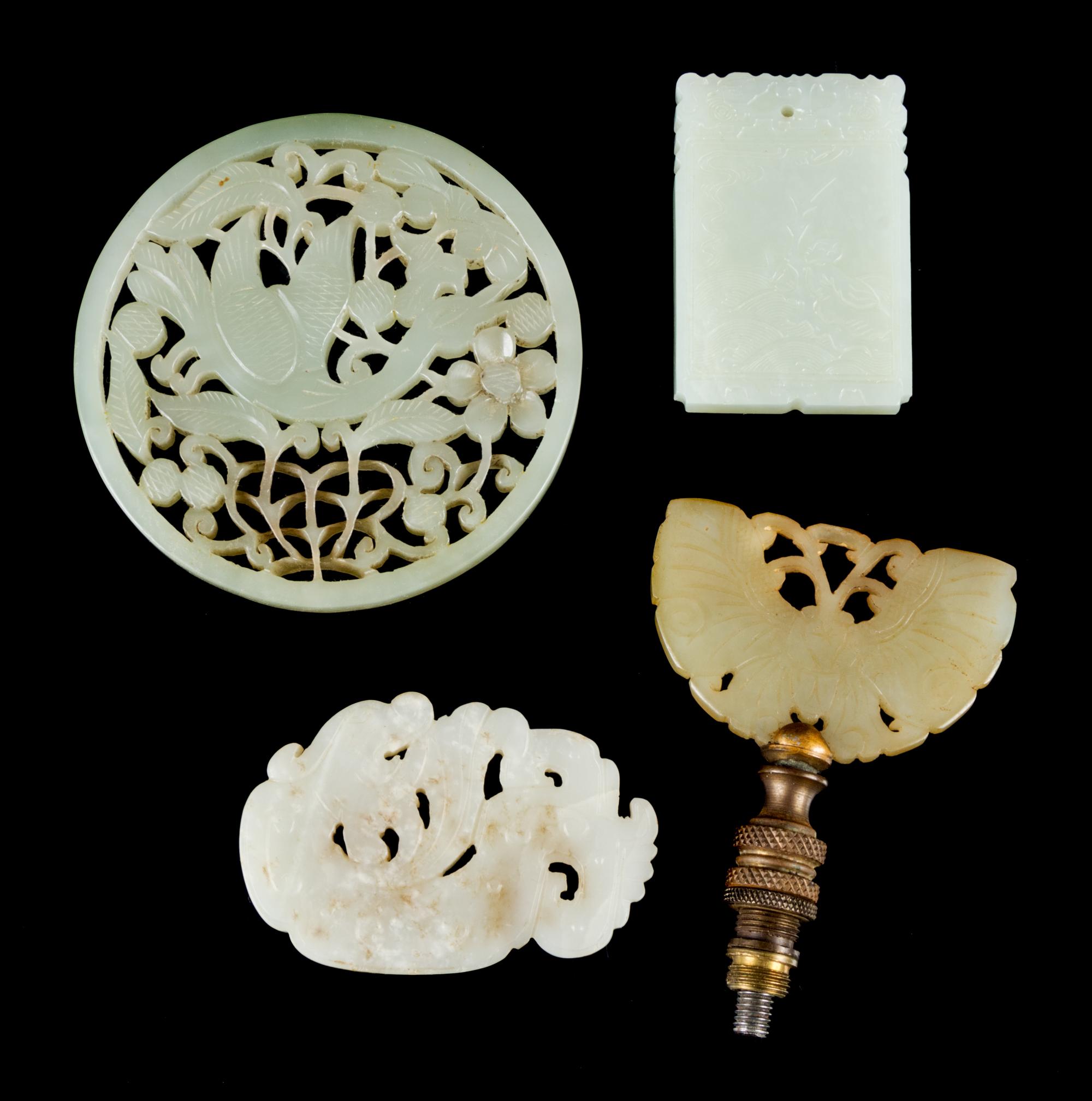 Four Jade Plaques Diameter of larget 3 1/4 inches.