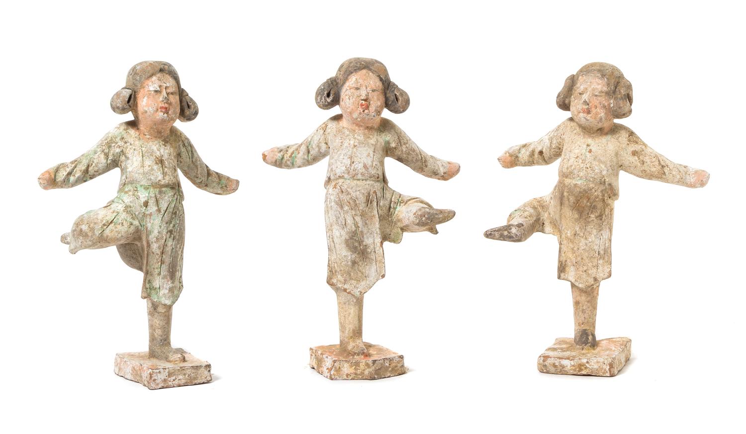 A Set of Three Painted Pottery Figures of Dancers Height of tallest 9 1/4 inches. — TANG DYNASTY