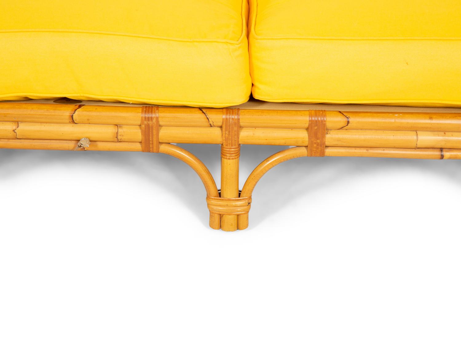 A Bielecky Brothers Rattan Settee with Two End Tables and a Pair of Ottomans