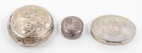 A Group of Three Silver Boxes, , comprising two examples with monograms and one oval example with classical decoration
