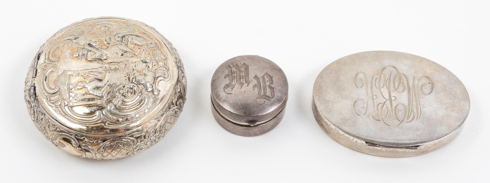 A Group of Three Silver Boxes, , comprising two examples with monograms and one oval example with classical decoration