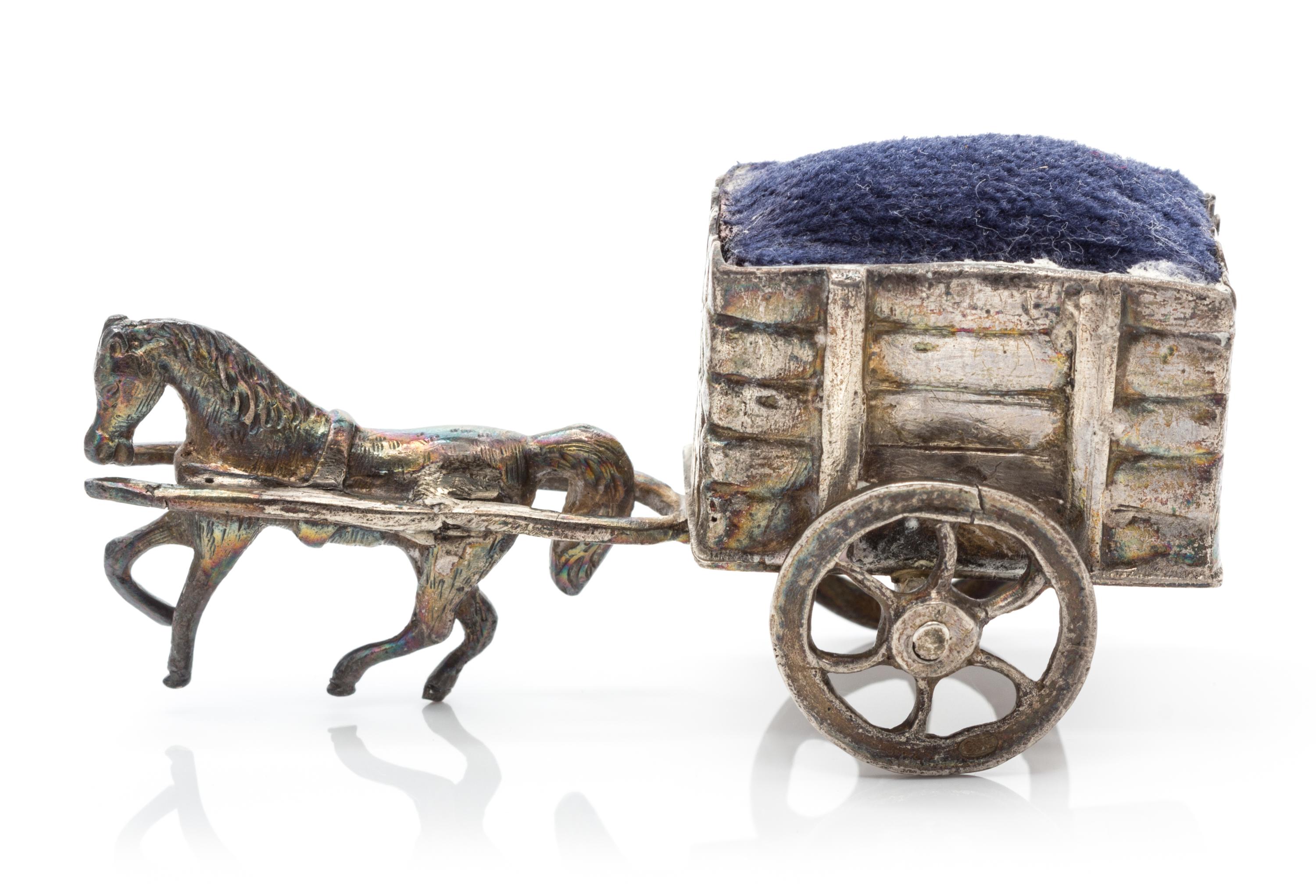 A German Silver Pin-Cushion, Hanau Marks, 19th Century, in the form of a horse pulling a cart.