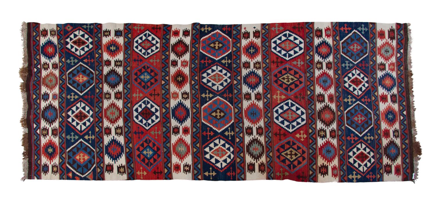 A Caucasian Kilim Flatweave Wool Rug, 9 feet 11 inches x 4 feet 5 inches.
