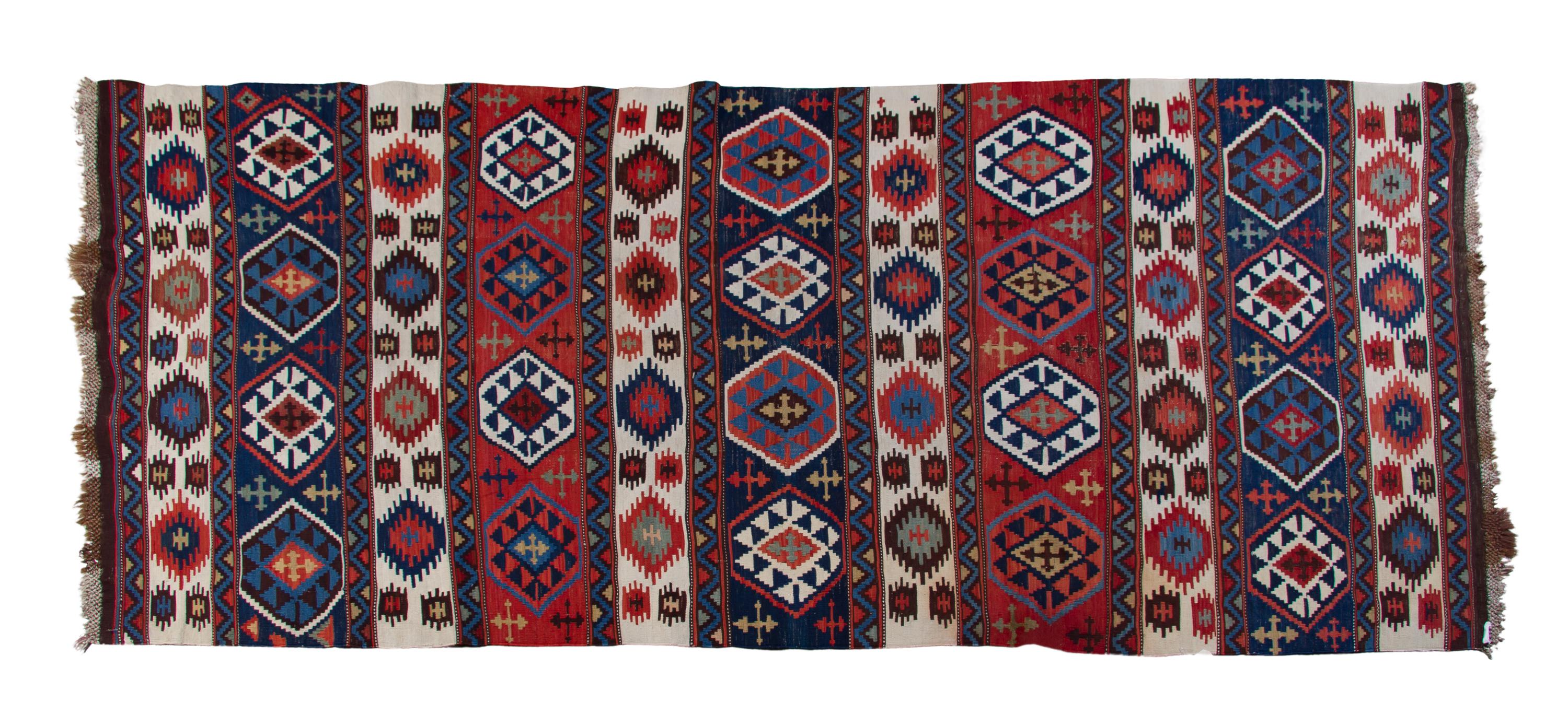 A Caucasian Kilim Flatweave Wool Rug, 9 feet 11 inches x 4 feet 5 inches.