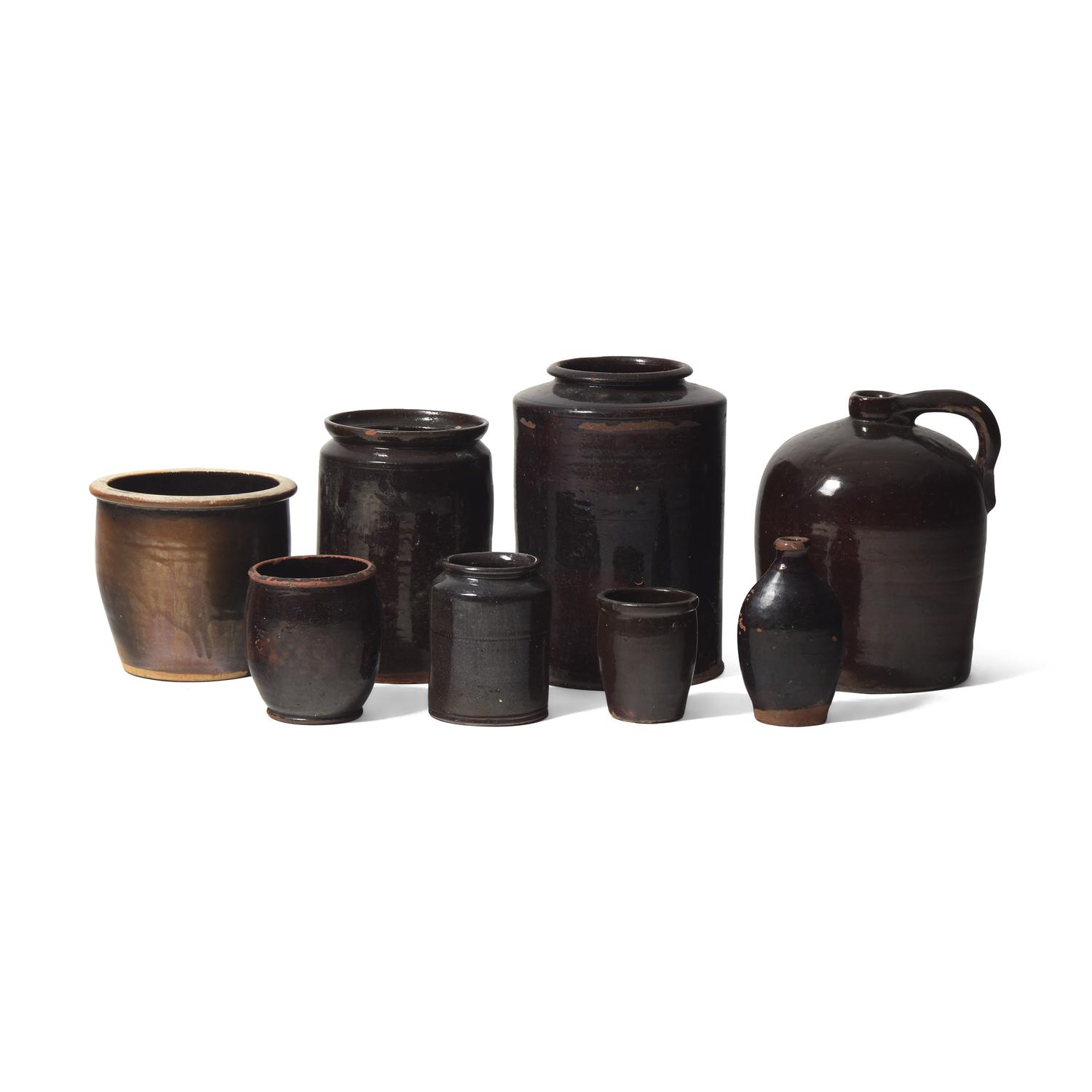 A Group of Eight Albany Glazed Redware Items