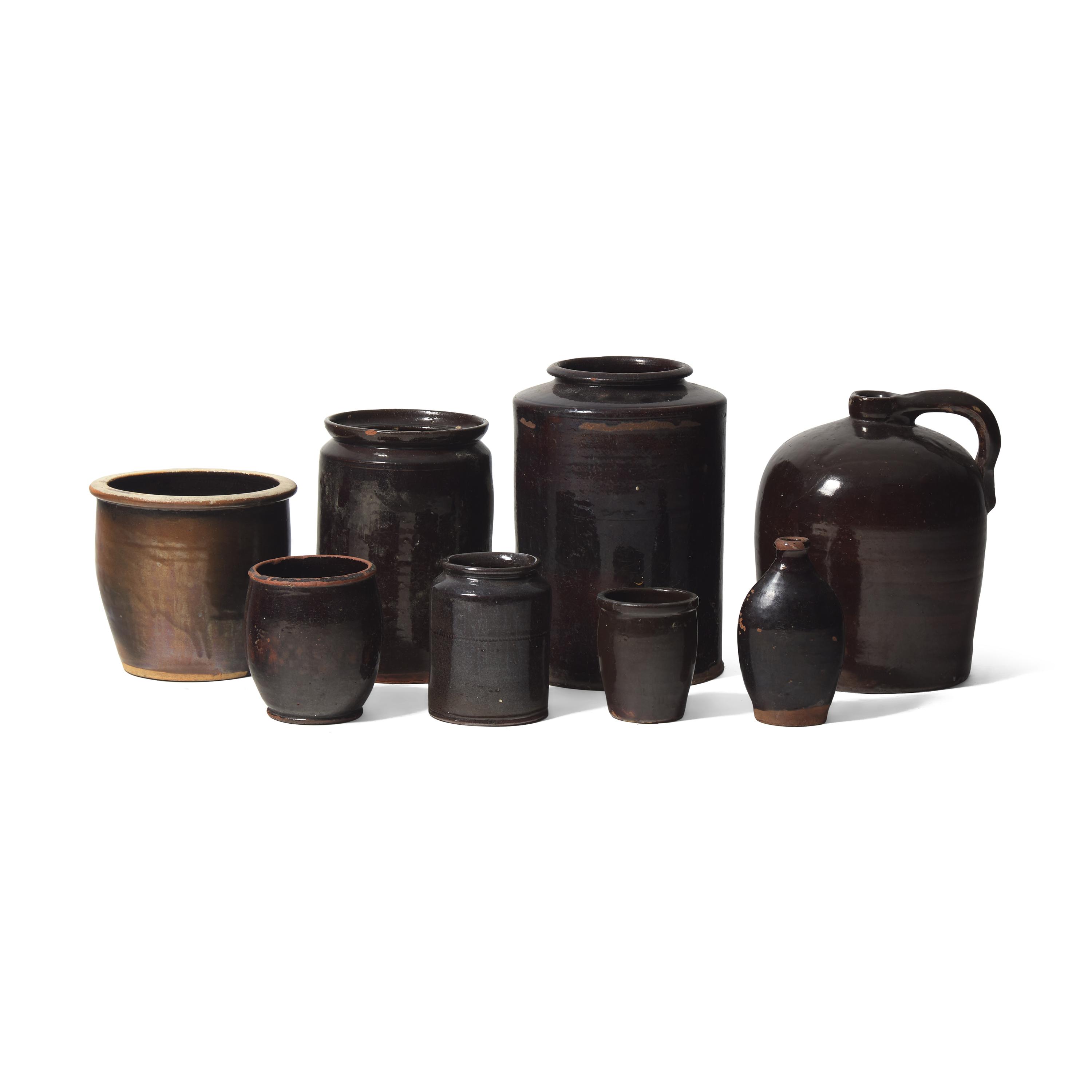 A Group of Eight Albany Glazed Redware Items