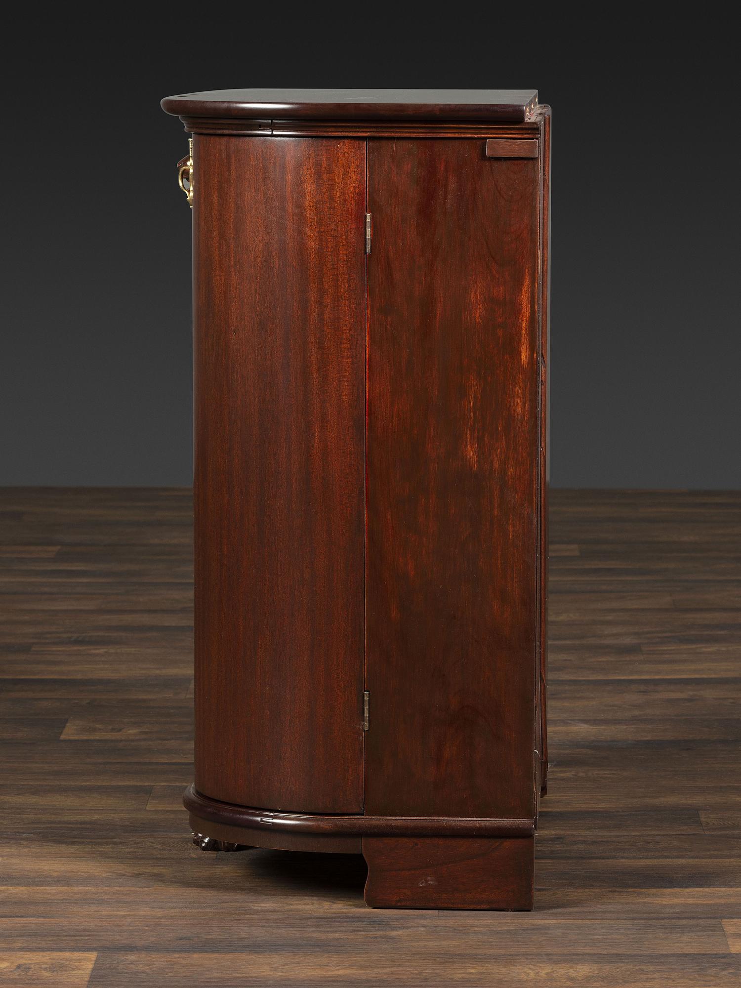 A Salter Double Bow-Front Lion Mask Carved Mahogany Record Cabinet