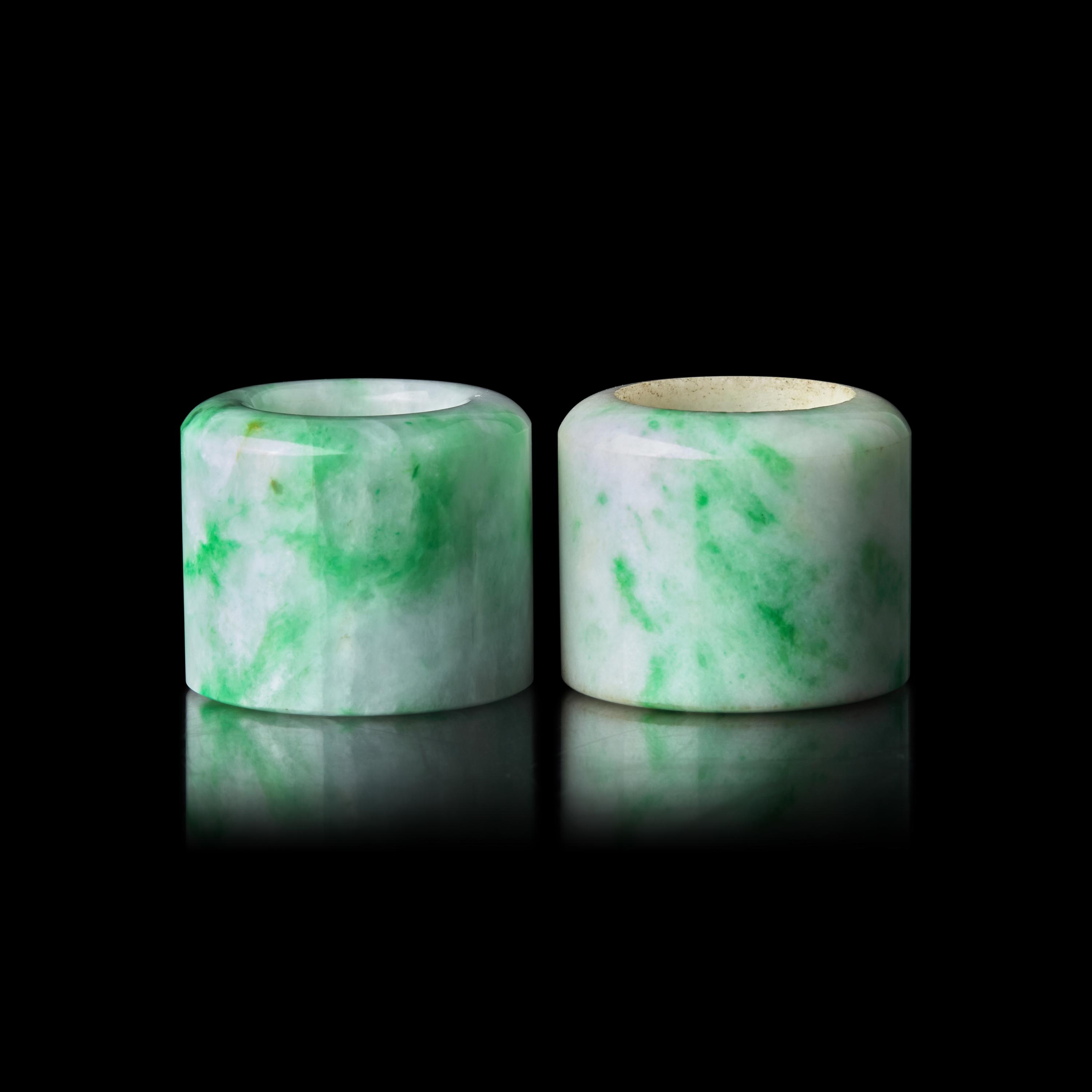 An Associated Pair of Chinese Apple Green and Celadon Jadeite Archer’s Rings, Late Qing/Republic Period 晚清-民國 翡翠扳指兩枚