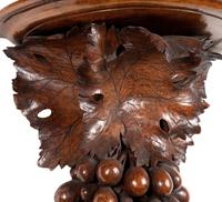 A Pair of Continental Carved Walnut Wall Brackets