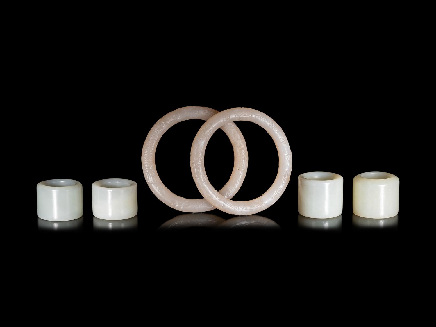 Four Chinese Celadon Archer's Rings and Two White Jade Bangles