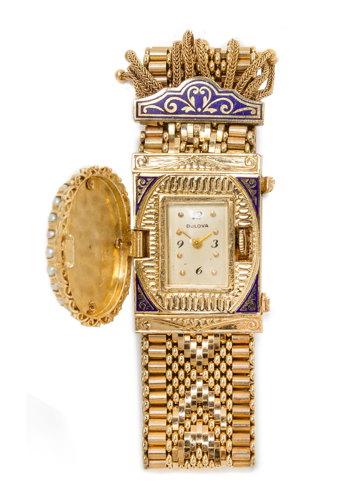 A 14 Karat Yellow Gold, Diamond, Cultured Pearl and Enamel Belt Bracelet Surprise Wristwatch, 42.30 dwts.