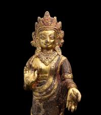 A Nepalese Gilt Bronze Standing Figure of Dipankara